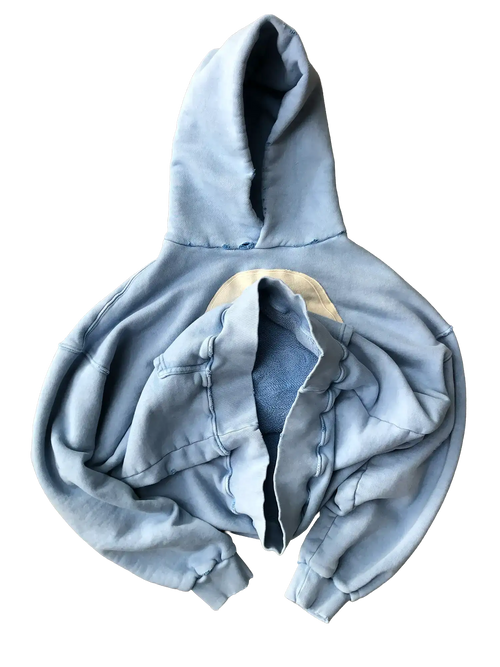 Flat lay of folded light blue Faceless sweatshirt showing centered face appliqué detail