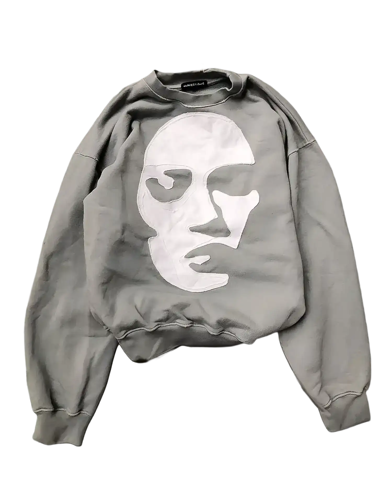 Gray oversized sweatshirt flat lay showing white stick-appliquéd face with eye openings